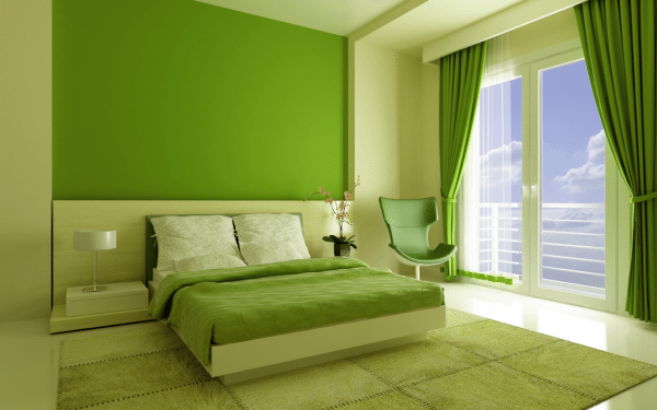 Trần nhà và các bức tường trong phòng ngủ được sơn màu xanh lá cây tinh tế.