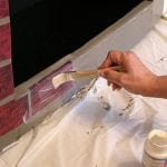Pintando uma lareira com tinta resistente ao calor