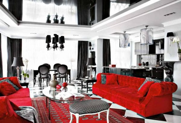 Obývacia izba v čiernej a bielej a červenej farbe